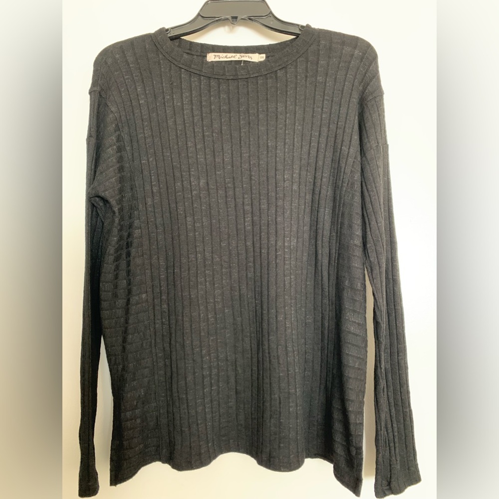 Black top by Michael Stars in black with long sleeves and thumb holes. Crew neck